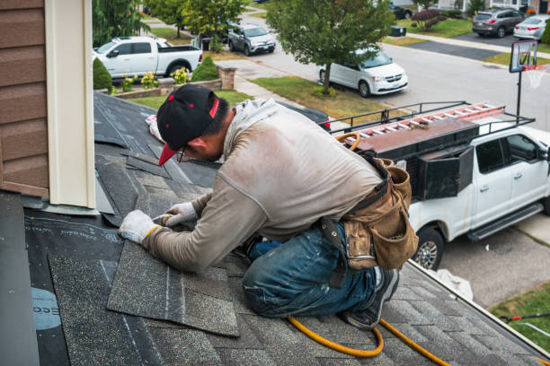 Professional Roof Replacement technician working in Zion, IL